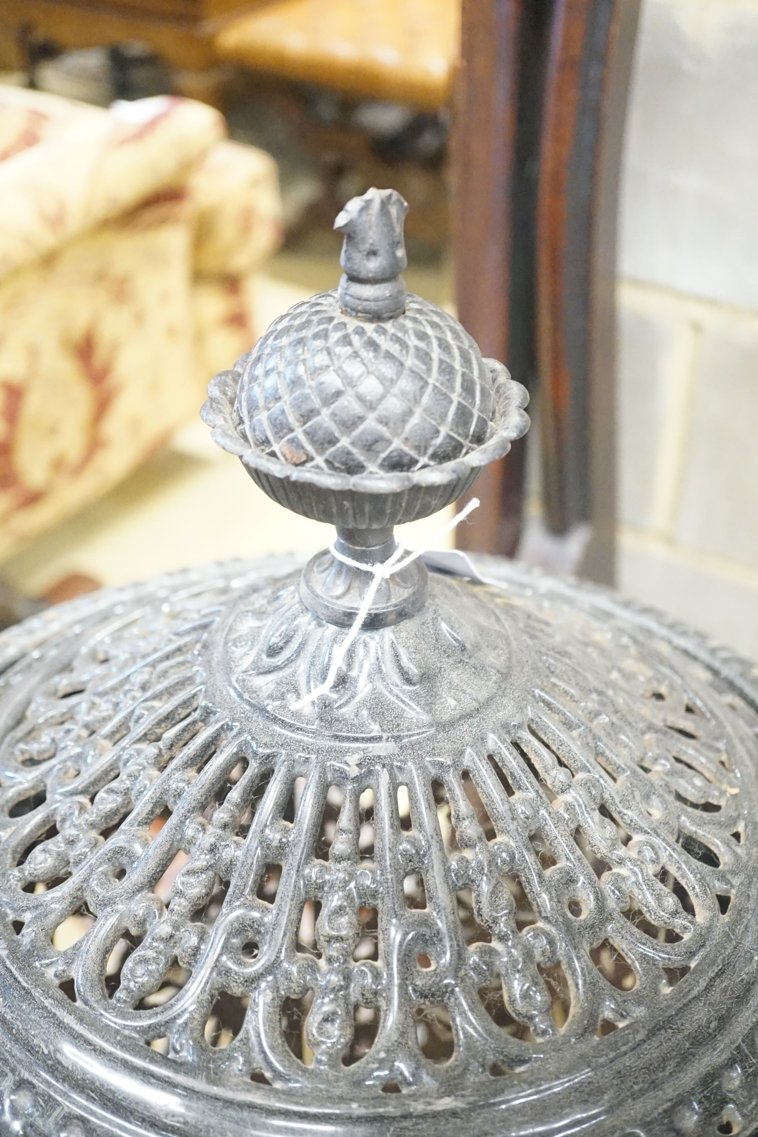 A French pierced enamel cylindrical cast iron conservatory heater, height 110cm